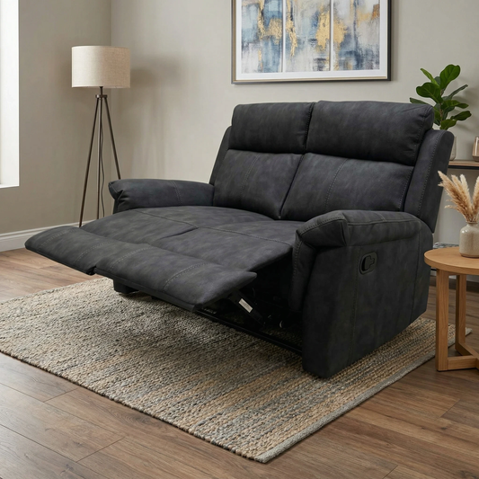 Living room shot of the Oscar charcoal leather 2-seater sofa in a contemporary living room setting.
