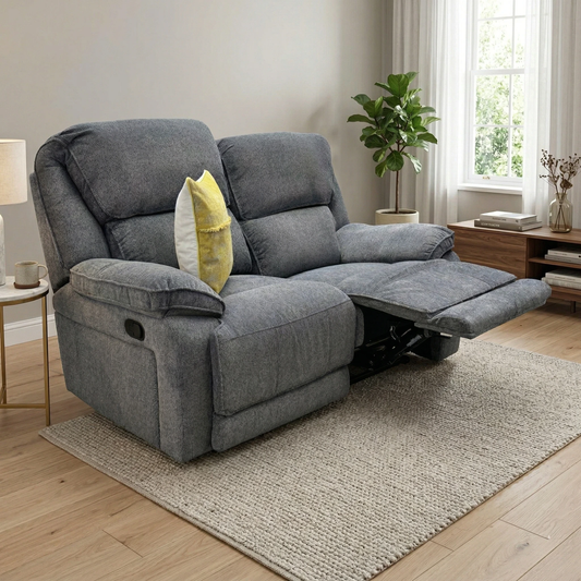 Lifestyle shot of the Costa 2-seater recliner sofa highlighting its textured charcoal grey fabric.