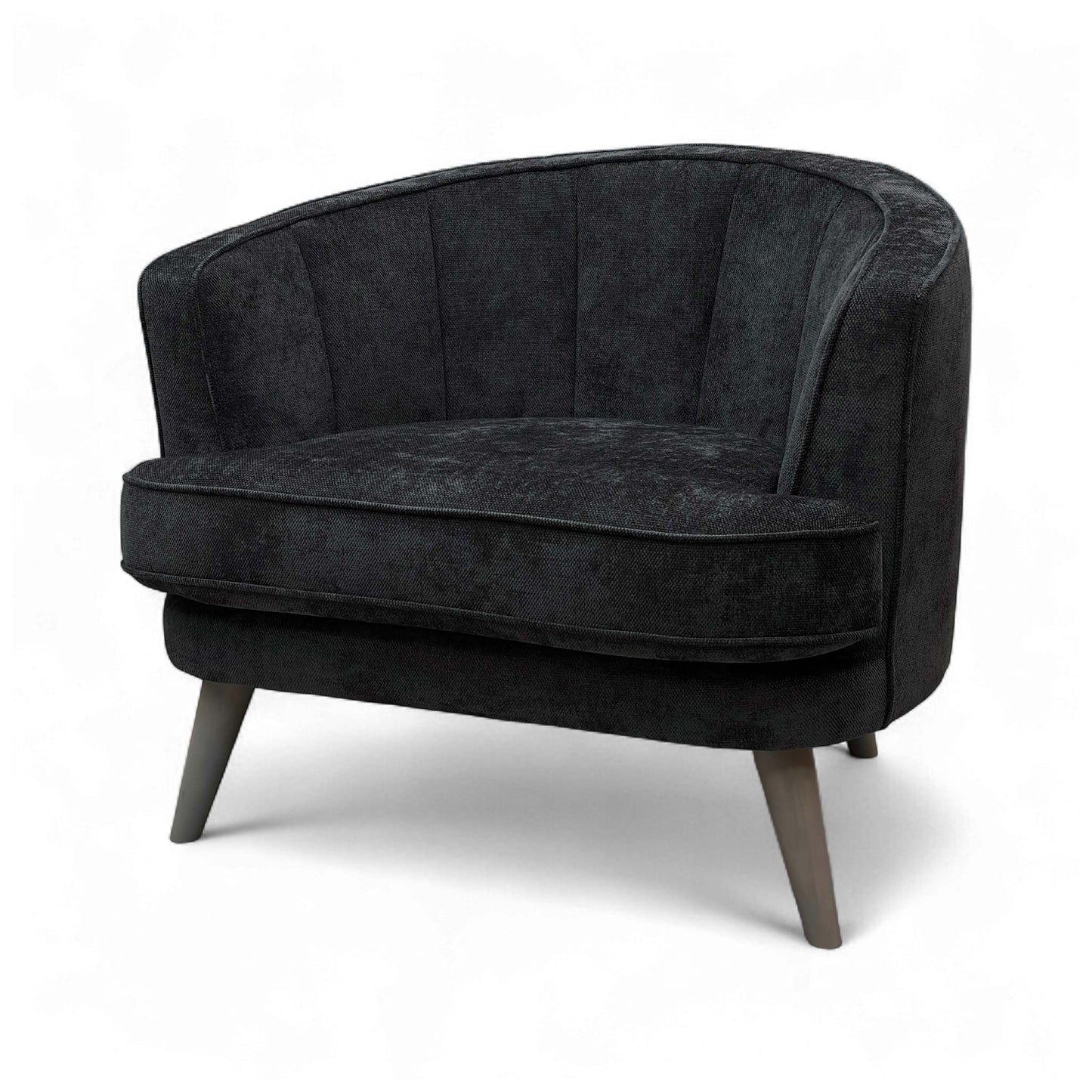 A view of the chair from a low angle, emphasizing the elegant tapered legs and the foam cushioning.