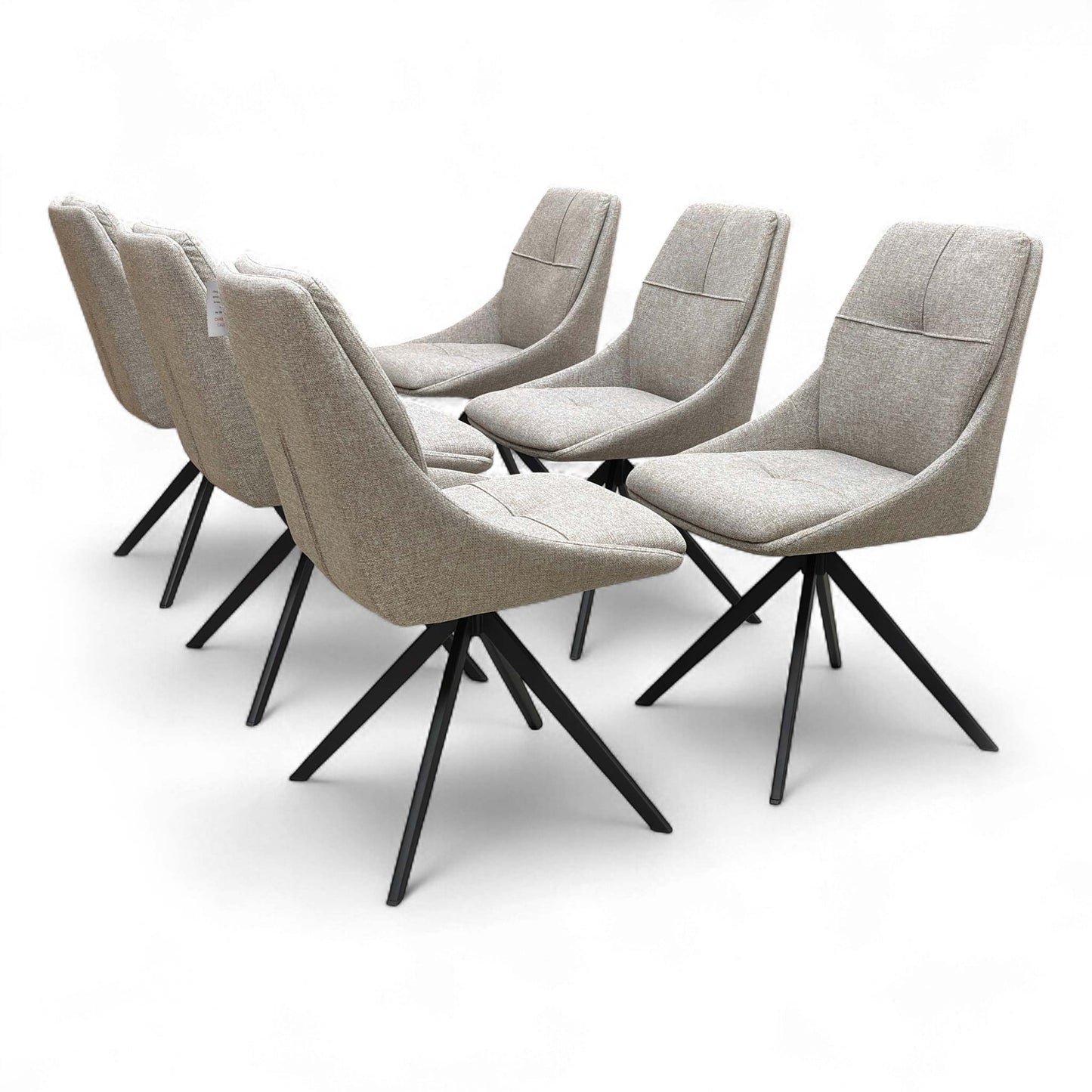 Back view of the ‘Jasmine’ Swivel Dining Chair, showing the smooth curve of the backrest and the metal leg structure.