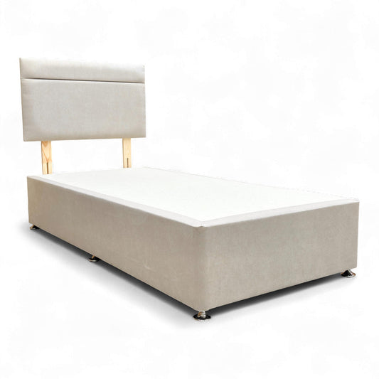Angled view of the Venice Mink Fabric bed, emphasizing the texture and upholstered finish of the headboard and base.