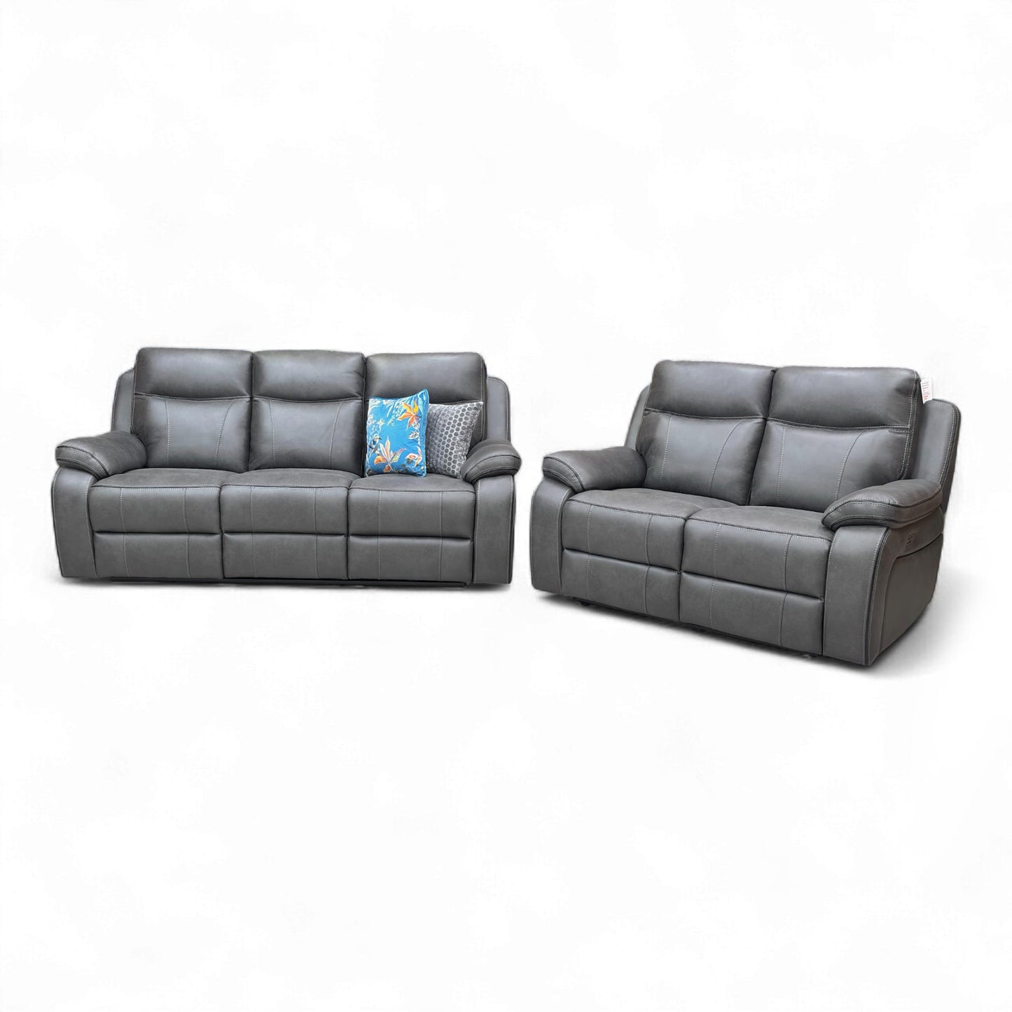 Angled view of the sofas in a room.