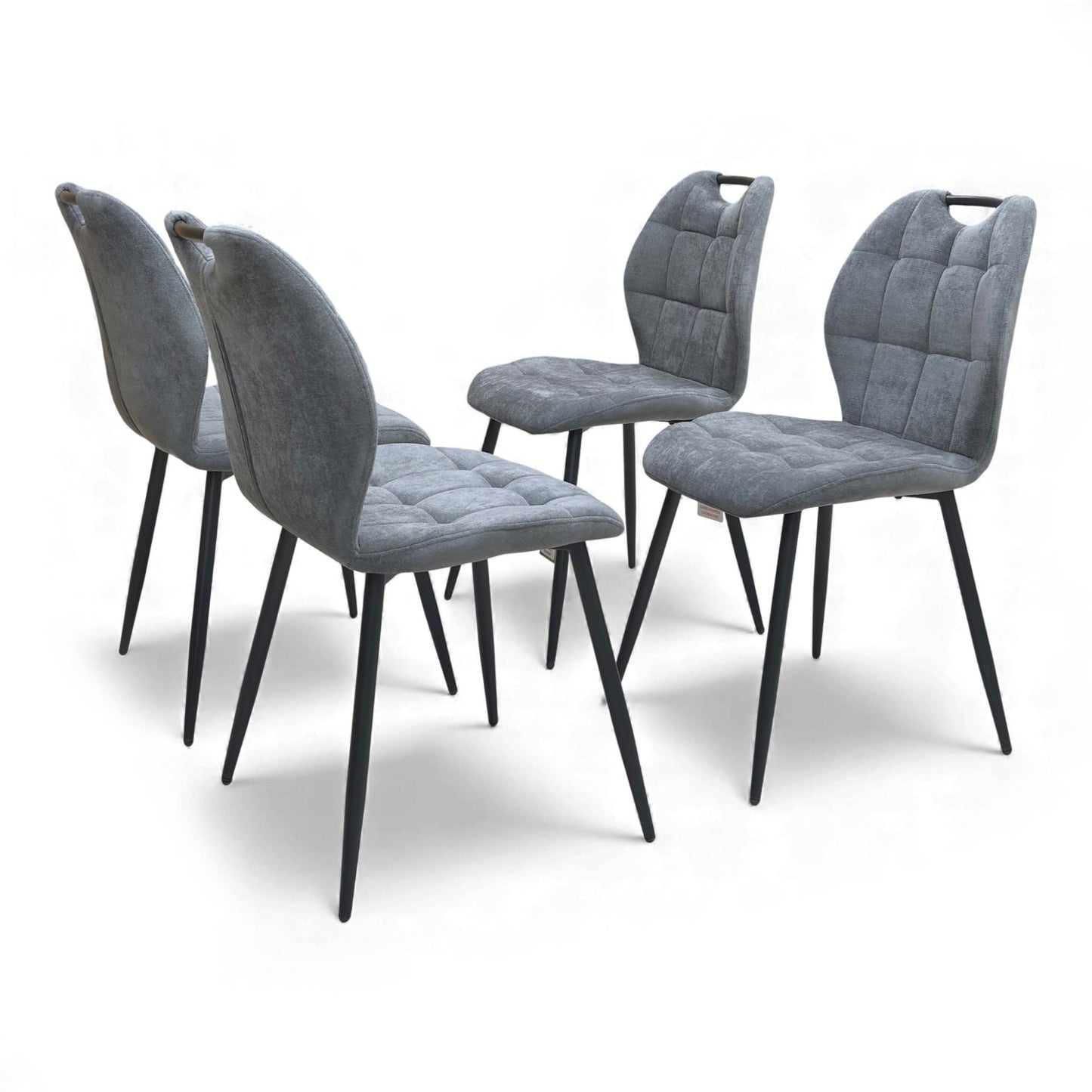 View of the backs of the Alva Charcoal Grey Dining Chairs.