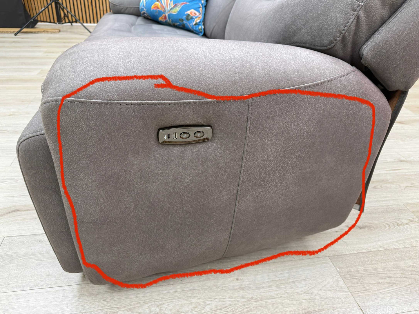 Another close-up shot showing the noted discoloration on the sofa upholstery.