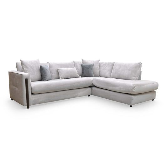 Full view of the Thornbrook ‘Barney’ right-hand facing chaise corner sofa in luxurious silver towel velvet, styled in a contemporary living room.