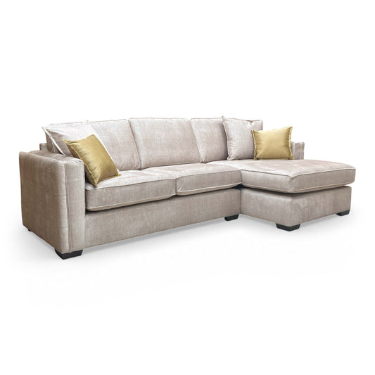 Front view of the Thornbrook ‘Chelsea' Large Corner Chaise, featuring luxurious beige Vogue velvet upholstery and a right-hand facing open-end design.