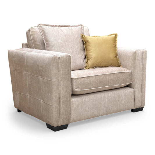 Front view of the Thornbrook 'Chelsea' Snuggler Chair, featuring plush beige Vogue velvet upholstery and a sophisticated formal back design.