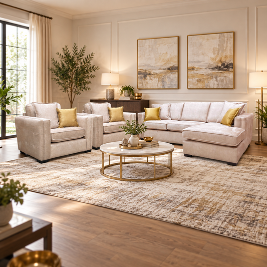 Chelsea beige velvet corner chaise and two snuggler chairs in a living room with a round gold coffee table
