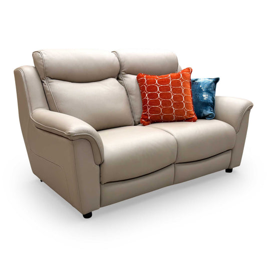 Front view of the Parker Knoll 'Manhattan' 2-seater sofa upholstered in premium light beige leather, showcasing its clean contemporary design.