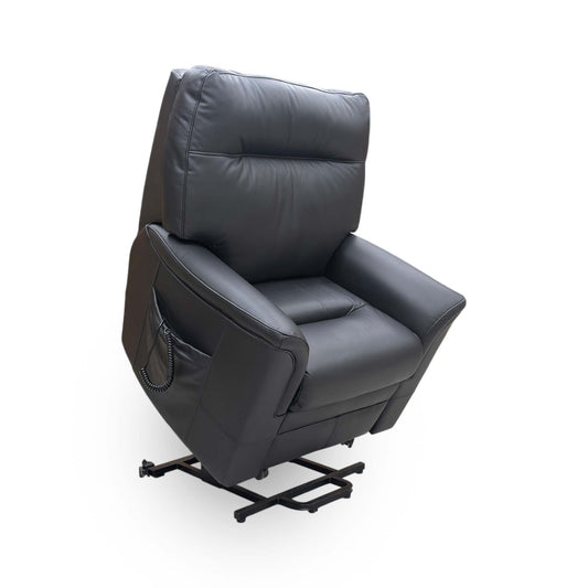 Full view of the Parker Knoll ‘Hudson’ lift and rise armchair in Como Black leather, featuring a classic high-back design and plush cushioning for ultimate comfort.