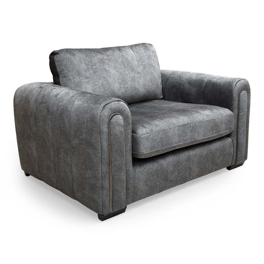 Full view of the Very ‘Amara’ snuggle chair in charcoal velvet, featuring a deep, plush seat and modern design.