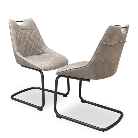 Full view of the Warrior taupe fabric cantilever dining chairs in a set of two.