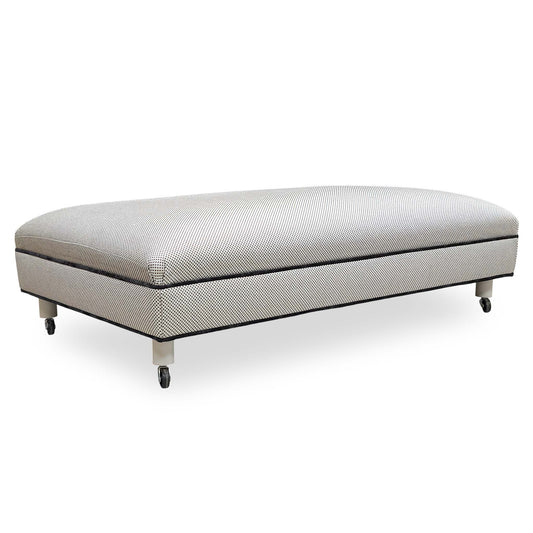 Front angle view of the Furniture Village ‘Ambassador’ Allure Noir Eby Ft fabric footstool in a deep charcoal finish.