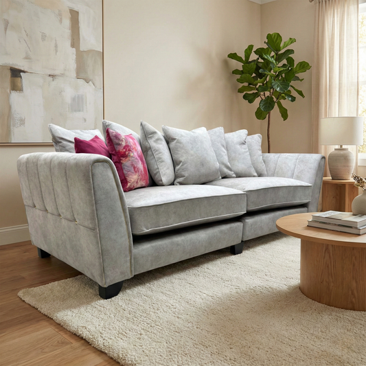 Living Room view of the 4-seater ‘Mariah’ sofa, showcasing the deep seats and plush scatter cushions.