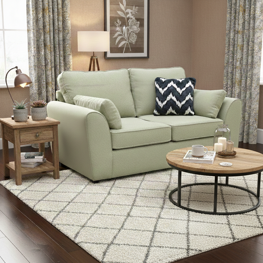 Living Room view of the Julius sage green 2-seater sofa, highlighting its structured formal back and tailored arms.