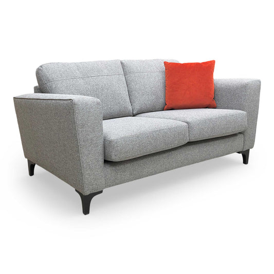 Full view of the Thornbrook ‘Lille’ Ashley silver fabric 2-seater sofa with a formal back design.