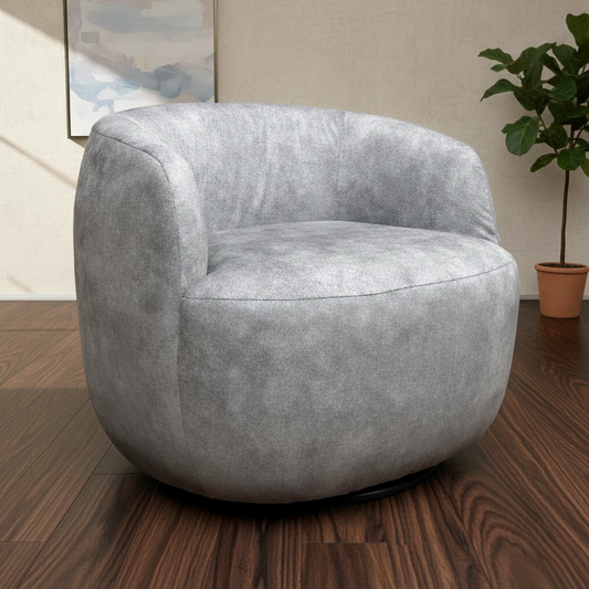 Living room of the ‘Terry’ Silver Velvet Accent Chair, highlighting its 360-degree swivel feature, compact design, and soft velvet finish.