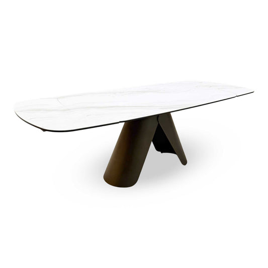 Full view of the Perla dining table featuring a high-gloss grey ceramic top and a modern black pedestal base.