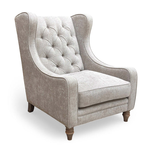 The ‘Cotswold’ Savoy Mink Wing Accent Chair, featuring classic country house charm with deep buttoning and elegant winged sides.