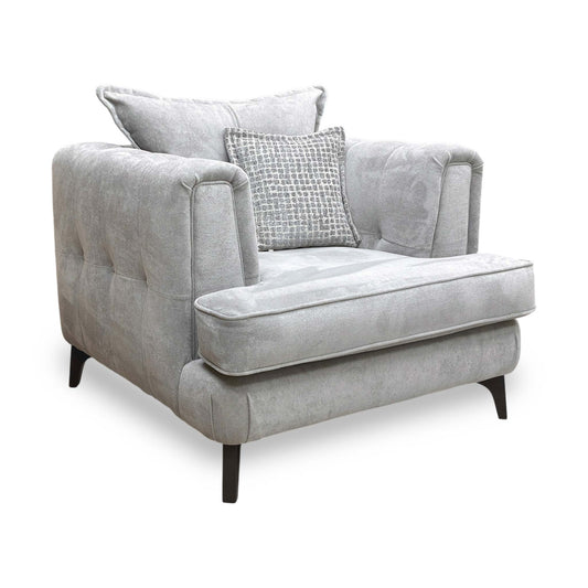 Full view of the ‘Farrah’ classic back armchair in Riga Silver and Zena Silver fabric, featuring elegant flared arms, a deep-seated cushion, and a sophisticated monochromatic aesthetic.