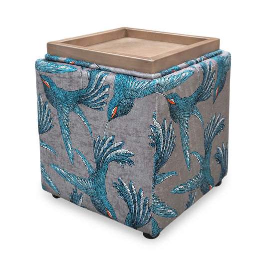 Full view of a square Bronwyn storage footstool by The Lounge Co. featuring a "Paradise Bird Grey" patterned fabric with floral and avian motifs.