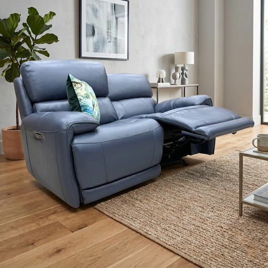 Living room of the Rocco sofa, highlighting the plush padded armrests and the vibrant Ocean Blue leather upholstery.