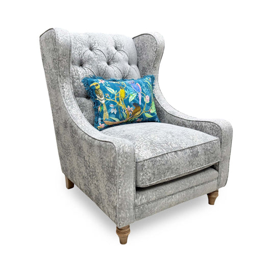 Full view of the Blenheim Winged Accent Chair upholstered in Savoy silver fabric, featuring a classic winged high back and dark wood legs.