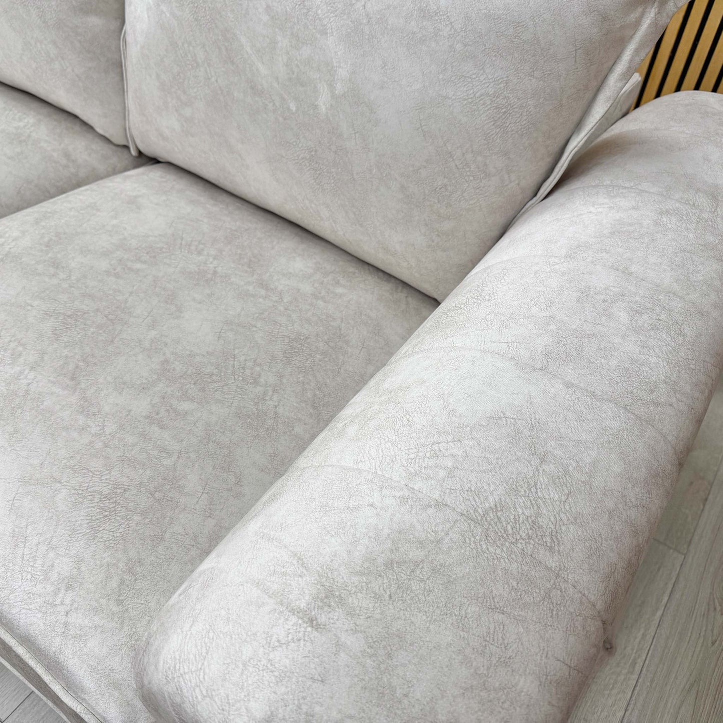 Close-up of the left-hand facing chaise extension, demonstrating the generous lounging area and integrated comfort of the design.