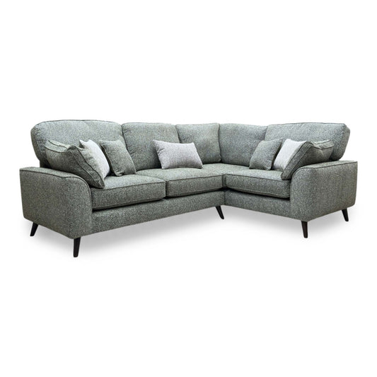 Theodore sage green woven fabric formal back right hand facing corner sofa in a living room lifestyle setting with wood slat wall and scatter cushions