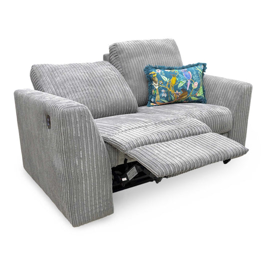 Full View DFS ‘Heydon’ 2-seater power recliner sofa, upholstered in soft, textured slate grey jumbo cord fabric with integrated power reclining seats.