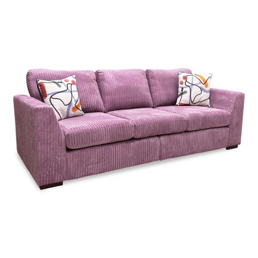Full View DFS ‘Heydon’ large 4-seater sofa, fully upholstered in soft, textured lilac purple Marley jumbo cord fabric, showcasing its expansive, comfortable design.