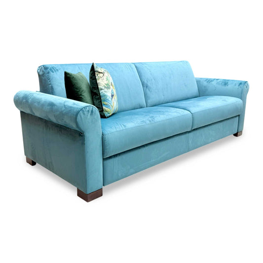 Full view of the Furniture Village Nicoletti ‘Alcova’ 3-Seater Sofa in sumptuous teal velvet, showcasing its contemporary silhouette, refined proportions, and clean-lined Italian design.