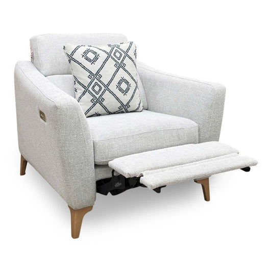 Full view of the Moderna power recliner armchair in pearl grey fabric, featuring a sleek modern design, deeply padded back cushions, and structured armrests.