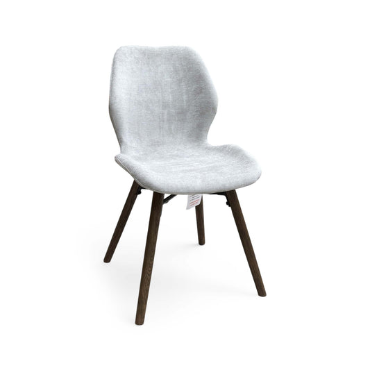 Full View Furniture Village ‘Stockholm’ mid-century modern dining chair, featuring a solid dark oak frame with a neatly upholstered seat pad in a neutral grey fabric.