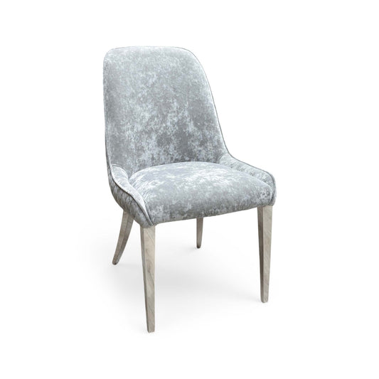 Full View Furniture Village ‘Dolce’ contemporary dining chair, beautifully upholstered in luxurious silver grey velvet fabric with an elegant polished metal frame.