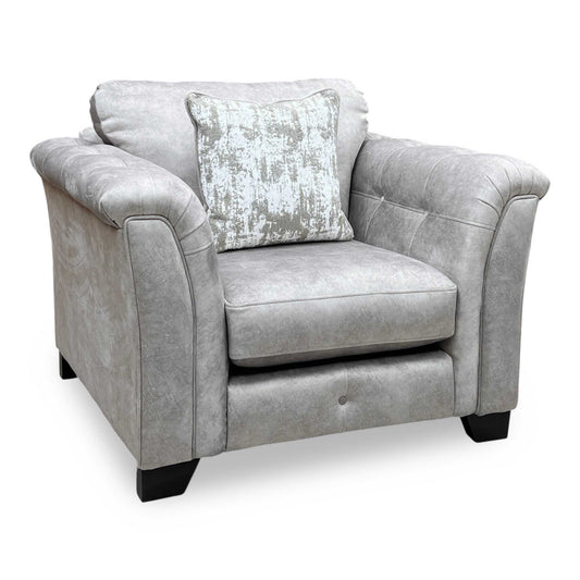 Full view shot of aura Kenzo Cream fabric armchair front view. Elegant contemporary single-seater lounge chair featuring plush textured cream upholstery, a deeply cushioned seat, and a sleek minimalist profile for modern living room spaces.