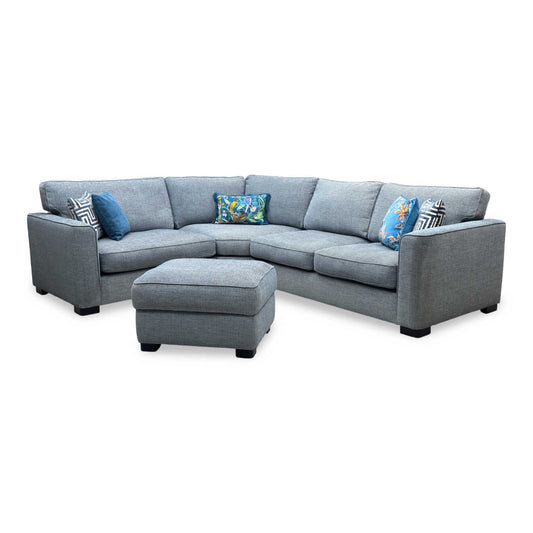 Full View ‘Elora’ left-hand facing corner sofa with a matching small storage footstool, beautifully tailored in textured Kento 229 Deep Sea Blue fabric.