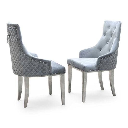 Full View ‘Dolce’ contemporary dining chairs, showing a matching set of 2 individual chairs beautifully upholstered in a luxurious, soft-touch grey velvet fabric with an elegant button-back design.