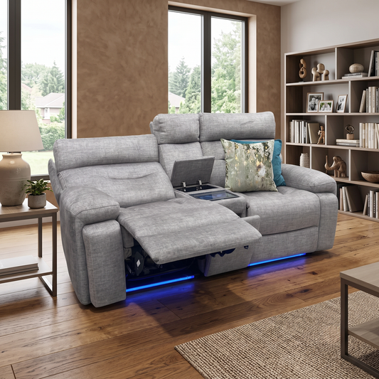 Styled upscale smart home theater or modern living room layout featuring the Cinemax taupe fabric media console reclining sofa arranged as a luxurious entertainment centerpiece.