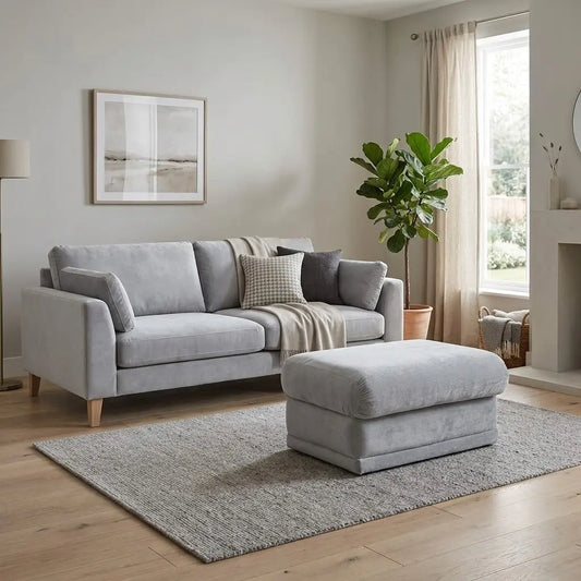 Styled upscale contemporary living room lifestyle layout featuring the G Plan Malvern grey fabric storage footstool arranged as a functional footrest, extra seat, and coffee table companion.