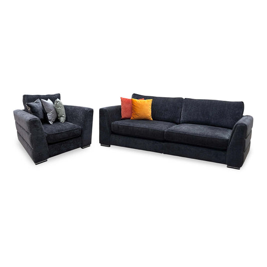 Bellissimo mirage black fabric 4 seater split sofa and armchair, angled view with red and orange scatter cushions