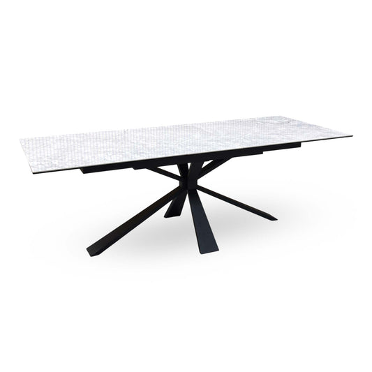 Crete white ceramic top extending dining table, angled view of the extended top on black spider legs