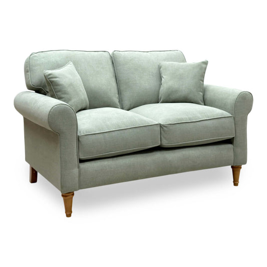 William olive green fabric 2 seater sofa, angled view showing the rolled arms and turned wooden legs