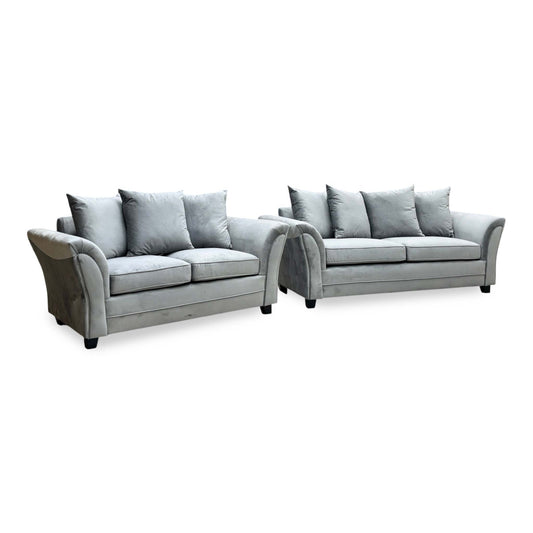 Leila grey velvet 3 + 2 seater scatter back sofa set, angled view with flared arms and dark feet