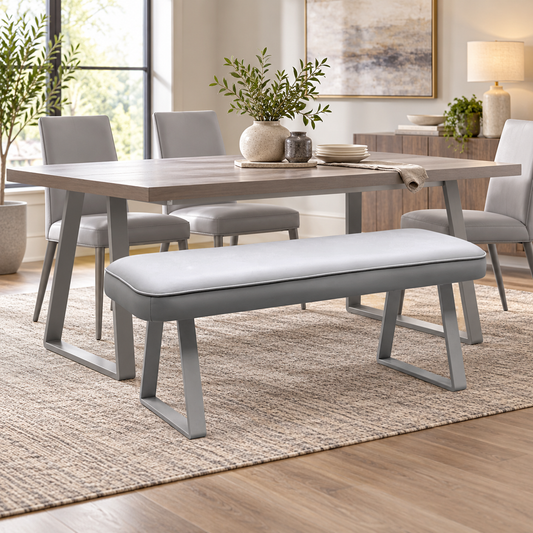Fumo light grey faux leather dining bench with grey metal sled legs under a wooden table in a room scene