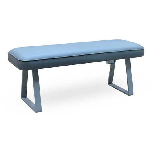 Fumo light grey faux leather dining bench, angled view from the left with sled-style metal legs