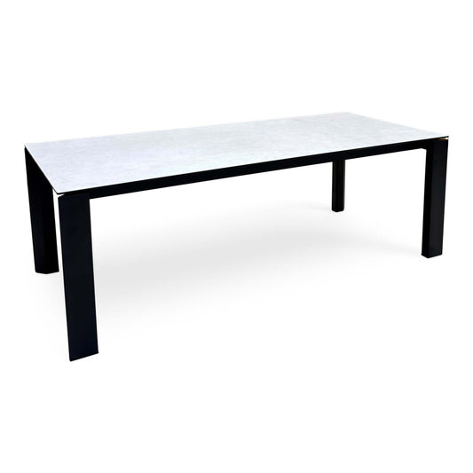 Connubia Viola light grey ceramic top 220cm dining table, angled view with black metal legs
