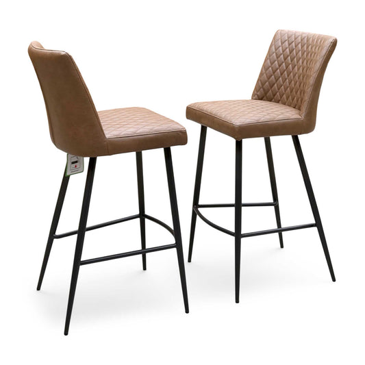 Earth tan brown faux leather pair of bar stools, angled view with diamond quilted backs and black legs