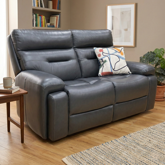 Living room view of the Cinemax sofa in Milled Navy, showcasing the deep-filled cushions and the sophisticated, rich blue tone of the Italian-style leather.