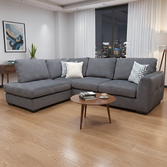 Living room of the ‘Dexter’ sofa, showcasing the neat edge stitching, subtle buttoning details, and stylish grey fabric.